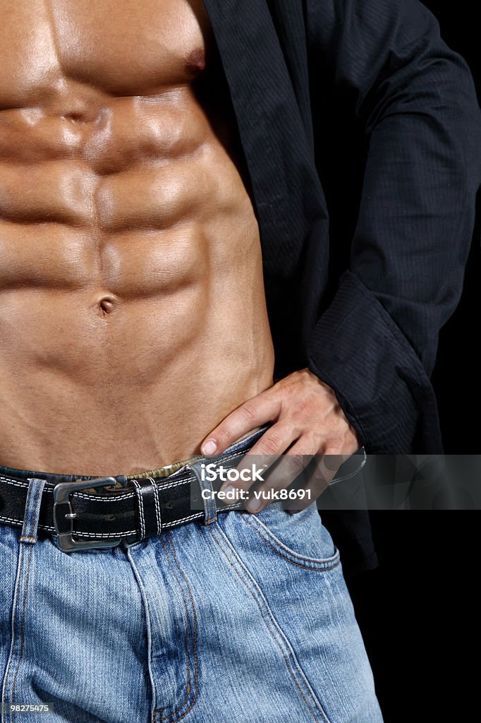 Perfect six-pack Handsome man detail-isolated on black background Abdominal Muscle Stock Photo