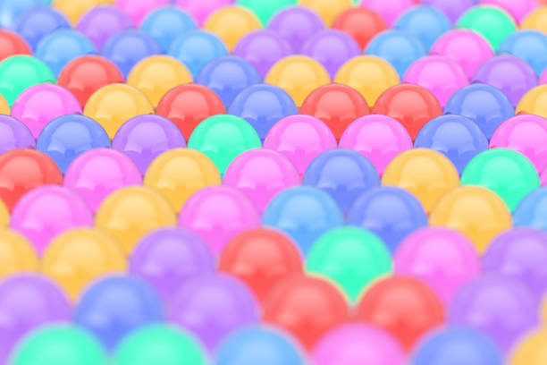 istock Rows of Color Glass Shine Balls with Reflections. 3d Rendering 982754964