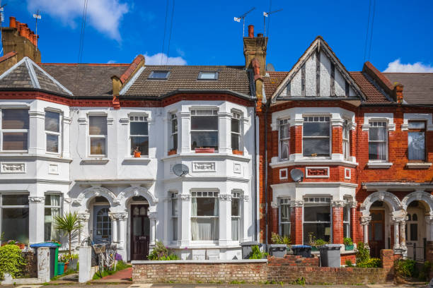 A row of typical red brick British terraced houses around Kensal Rise in London