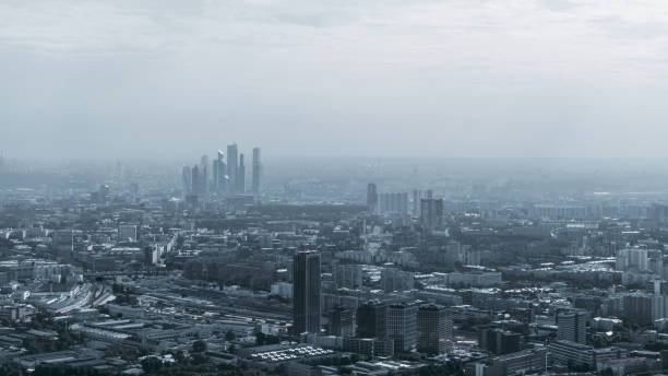 istock Dark megapolis cityscape on hazy day 982759830