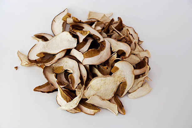 Close up of two mushroom slices on white background