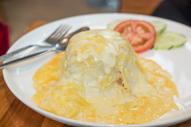 istock Cheese Omelette served on plate with tomato and cucumber. 982764186