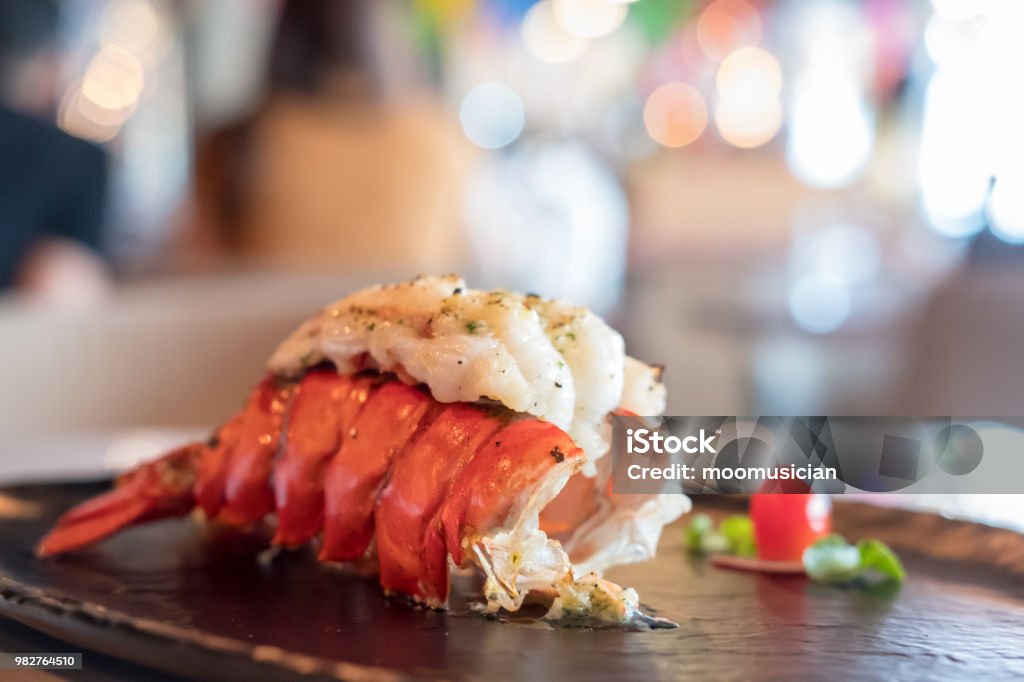 Grilled Lobster and vegetables on plate. Lobster - Seafood Stock Photo