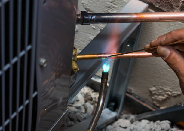 Soldering copper pipes during AC installation in Canada