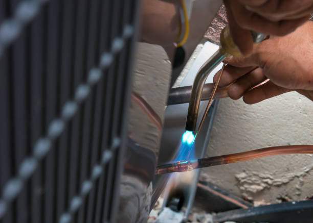 Soldering copper pipes during AC installation in Canada