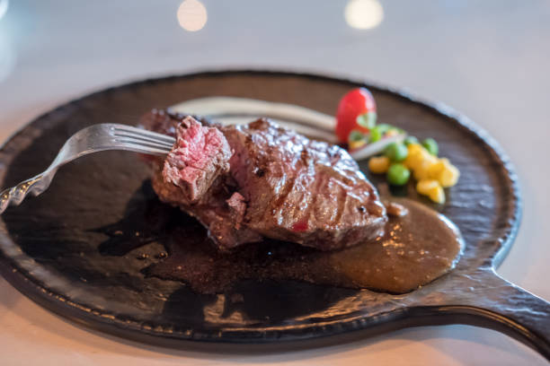 istock Medium rare meat on plate with sauce 982765256