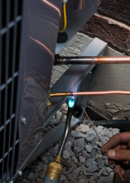 istock Soldering copper pipes during AC installation in Canada 982765290