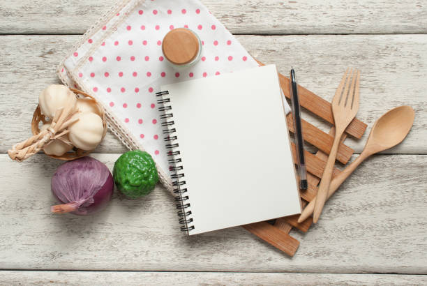 istock Book with wooden spoons on wood 982768880