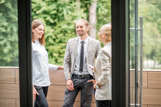 Business people on the office balcony during a break