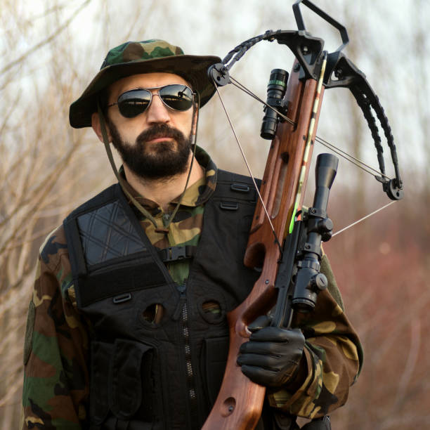 istock military man with crossbow 982769218