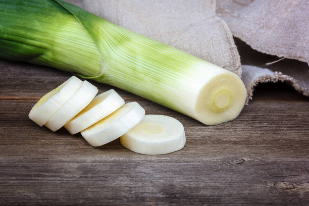 istock Onion green fresh on a wooden background 982775258