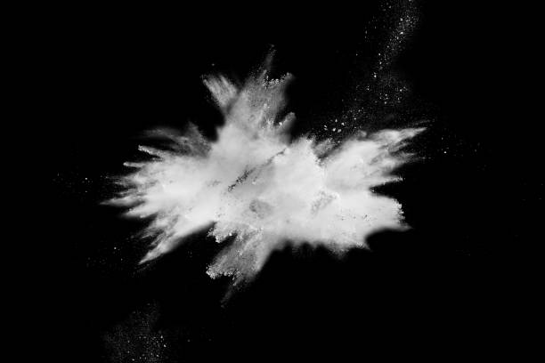 istock Launched white powder splash on black background. Bizarre forms of of white powder explosion cloud against dark background. 982780638