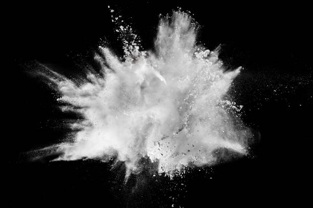 istock Launched white powder splash on black background. Bizarre forms of of white powder explosion cloud against dark background. 982780698