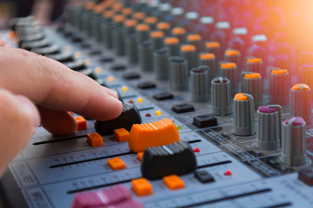 istock professional stage sound mixer closeup at sound engineer hand using audio mix slider working during concert performance 982784856