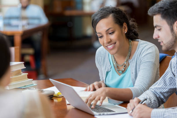 istock College students uses laptop in campus library 982800494