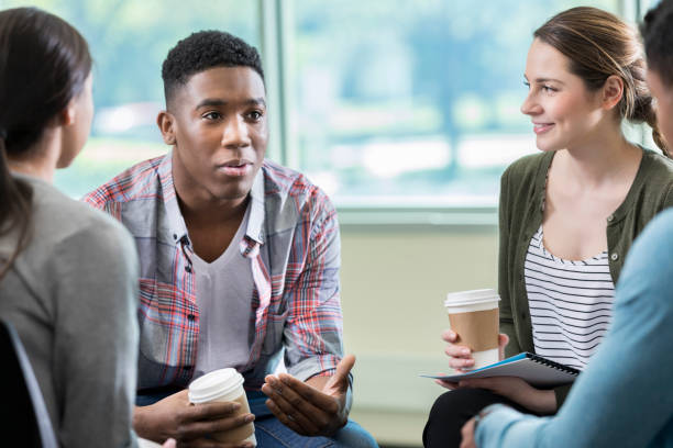 istock Serious young African American man in support group 982800686