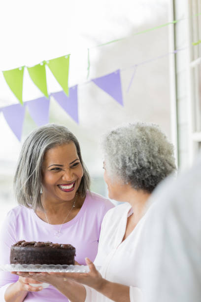 istock Women purchase cake during bake sale fundraiser 982800854