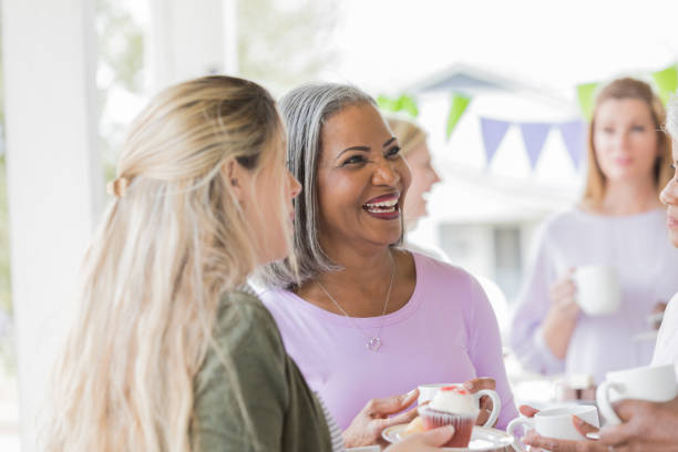 istock Diverse women enjoy dessert during charity event 982800890