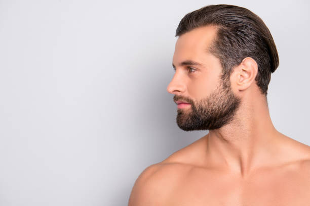 istock Profile side view half-faced portrait with copy space of handsome, muscular, athletic, confident, sporty, naked guy with perfect, ideal skin, isolated on gray background 982813156