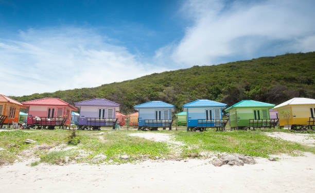 istock Tropical style colorful bungalow and blue sky background. 982815558