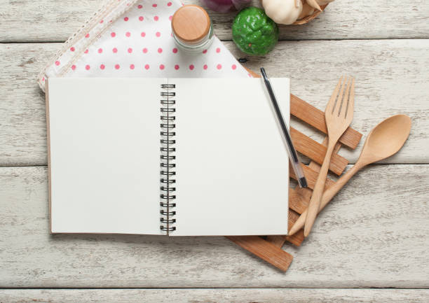istock Book with wooden spoons on wood 982822576