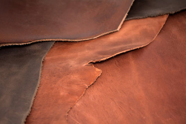 istock Texture of pieces brown leather. Natural material background. 982822948