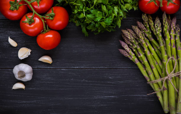 istock Fresh raw asparagus and vegetables 982823550