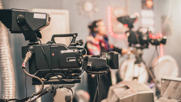istock Behind scene. Multiple camera. Cameraman shooting film scene with camera 982824810