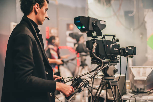 istock Behind scene. Multiple camera. Cameraman shooting film scene with camera 982825736