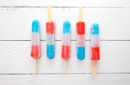Red White and Blue Popsicles in a Bowl of Ice to Keep them Cool for Serving to your BBQ Guests