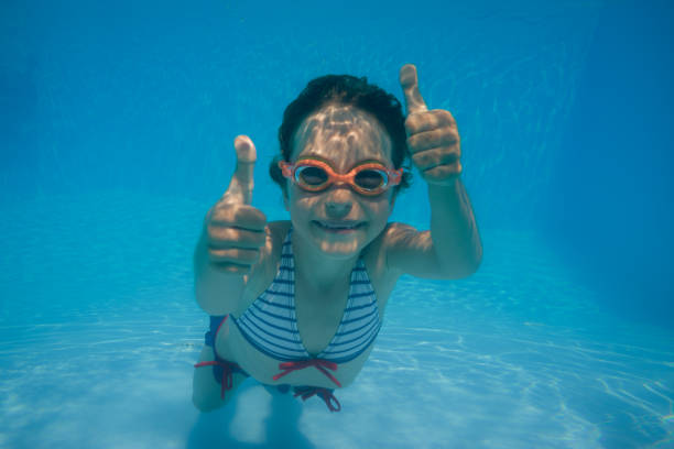istock Underwater portrait of child 982840960