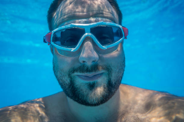 istock Underwater portrait of man 982840968