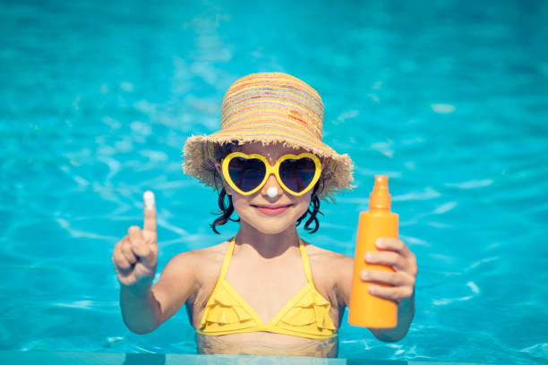 Child in swimming pool stock photo