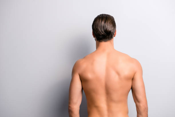 rear back behind view photo of strong muscular handsome attractive stunning confident ideal perfect sportsman isolated on gray background copyspace - rear view human arm naked men imagens e fotografias de stock