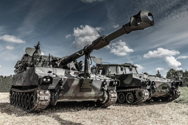 war machines on the battlefield war machines on the battlefield cannon artillery photos stock pictures, royalty-free photos & images
