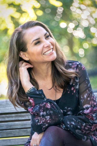 istock Smiling hispanic or middle eastern woman looking away 982856558