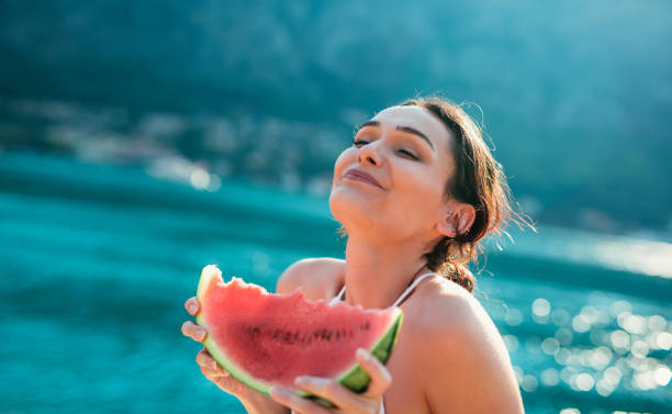 istock Eating and enjoying watermelon 982870150