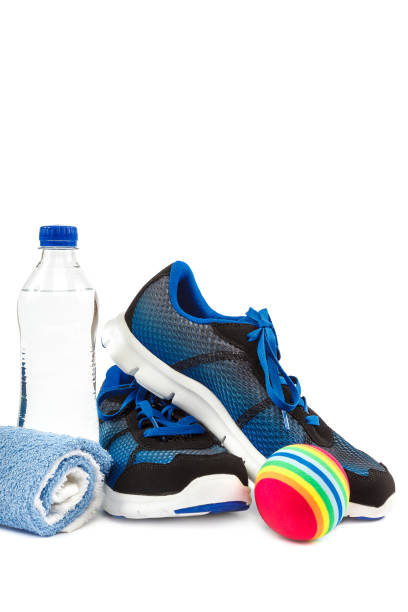 istock Stylish sneakers, towel and water bottle on white background. 982870516