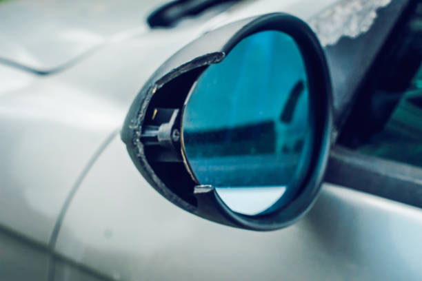istock Car accident,silver car with a broken rearview mirror 982874372