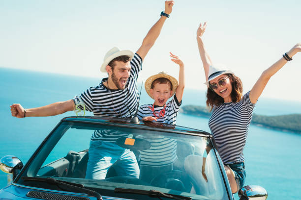 Happy family travel by car to the sea. Happy family travel by car to the sea. People having fun in cabriolet. Summer vacation concept convertible photos stock pictures, royalty-free photos & images