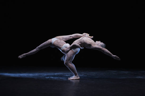 istock Man and woman in passionate dance pose 982888594