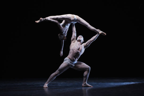 istock Man and woman in passionate dance pose 982888734