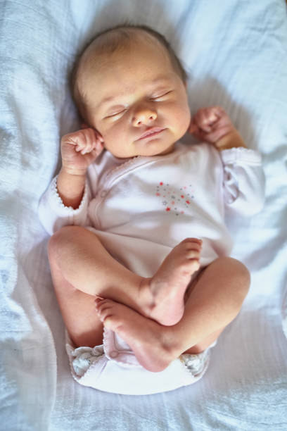 istock Newborn baby girl sleeping 982889184