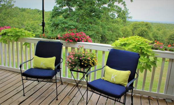 istock Summertime Deck for Two with Abundant Flowers 982892528