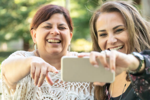 istock Friends posing together for a selfie 982896108