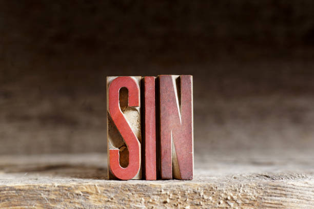 istock SIN - Single Word made up from Old Wooden Letters 982896190