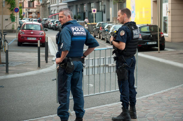 municipal police men  standing  in the street Mulhouse - France - 21 June 2018 -  municipal police men  standing  in the street mulhouse photos stock pictures, royalty-free photos & images
