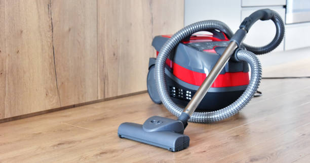 istock Canister vacuum cleaner for home use on the floor 982902736