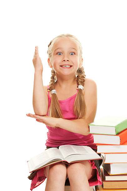 istock Little schoolgirl raised her hand to answer question 98290402