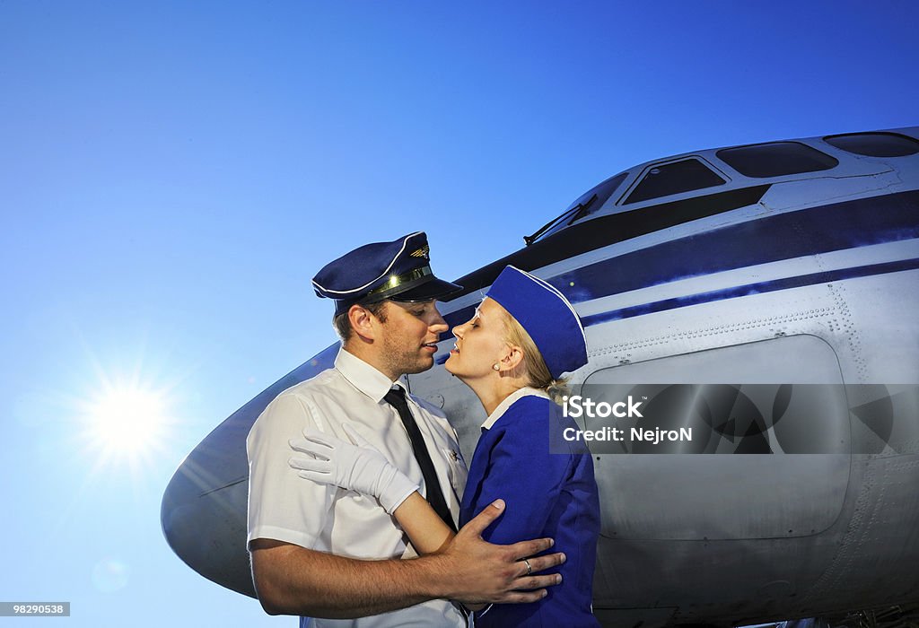 Cabin crew couple  Kissing Stock Photo